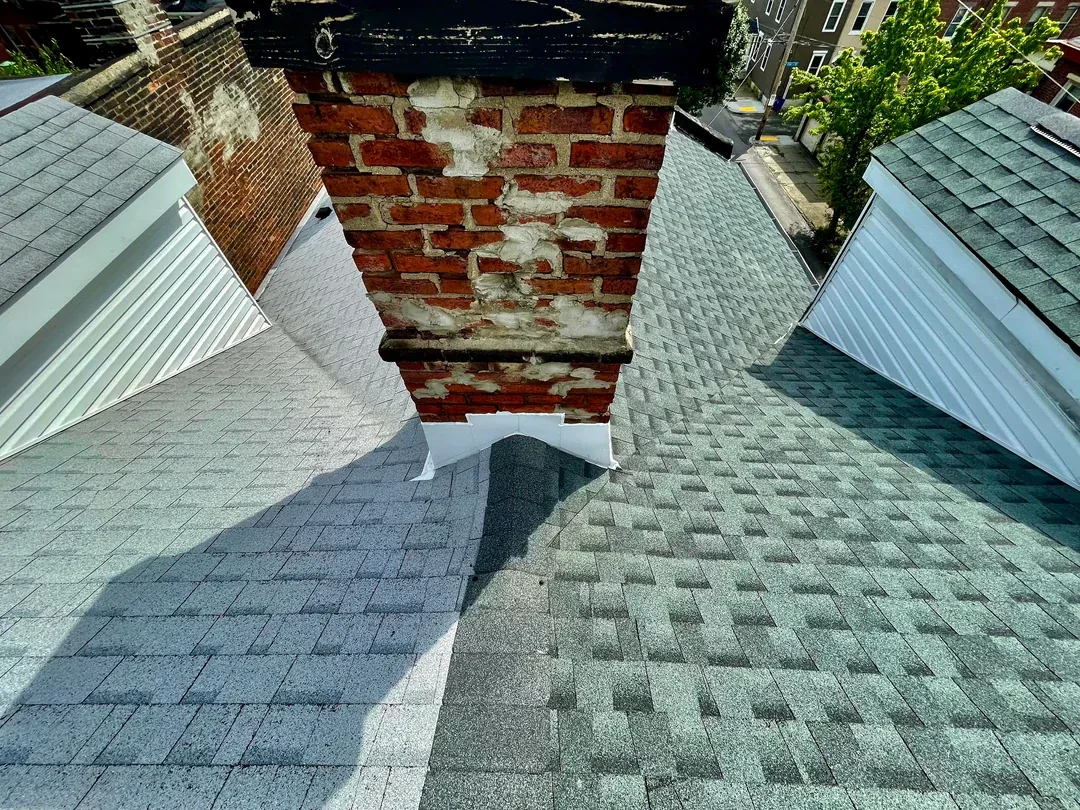 Roof valley flashing and shingle transition leak repair in Colesville